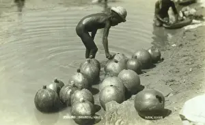 Haitian: Filling Gourds - Haiti