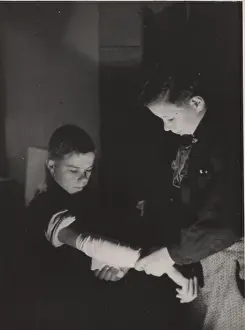 Bandaging: Finnish boy scouts doing first aid training, WW2