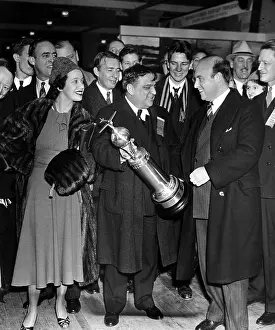 Fiorello: Fiorello LaGuardia, presenting cup to Andre ?