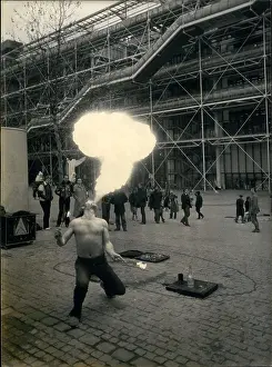 Juggler: Fire eater in street during Pompidou Centre strike, Paris