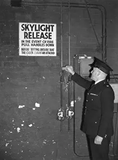 Skylight: Fire prevention officer checking skylight release