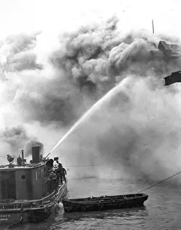 Tackling: A fireboat tackling a blaze on the River Thames