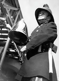 Adjust: Firefighter adjusting turntable ladder mechanism