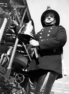 Adjust: Firefighter adjusting turntable ladder mechanism