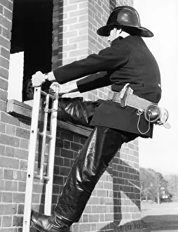 Waterproofs: Firefighter during hook ladder practice