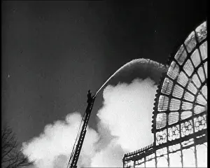 Extinguish: A Firefighter on a Ladder Trying to Extinguish