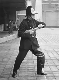 Drills: Firefighter taking part in a hose training drill