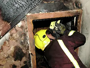 Reflective: Firefighter using a thermal imaging camera