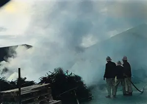 Pallets: Firefighters in action at a farm near Crediton, Devon
