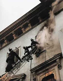 Dentils: Firefighters in action up a ladder
