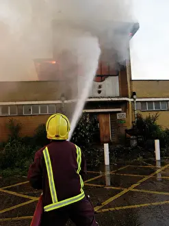 Reflective: Firefighters attend a fire at 1 Mollison Avenue