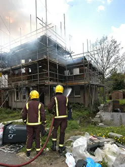 Reflective: Firefighters attend a house fire at Rydal Road