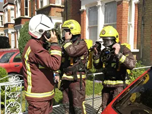 Reflective: Firefighters attending a fire at 81 Woolstone Road