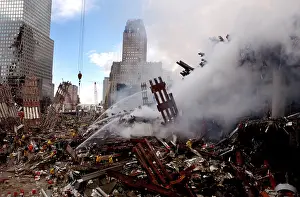 Douse: Firefighters douse the still burning pile ?