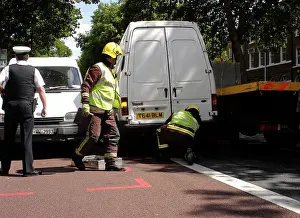 Paramedics: Firefighters inspecting a broken down Ford transit van
