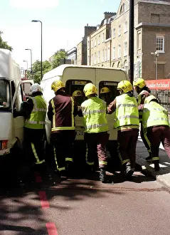 Manpower: Firefighters pushing a broken down Ford transit van