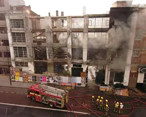 Gutted: Firefighters at scene of fire in Commercial Road