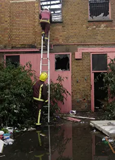 Paintwork: Firefighters at the scene of a fire in Ruskin Road