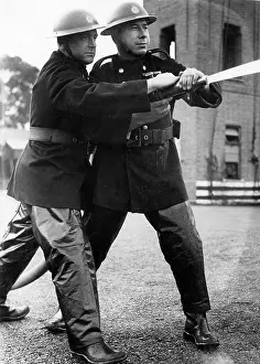 Drills: Firefighters taking part in a hose training drill, WW2