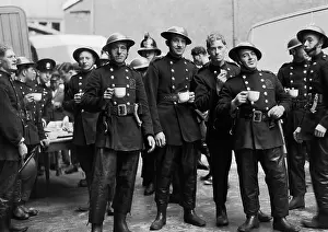 Tunics: Firefighters on a tea break after fire St Katherine's Dock