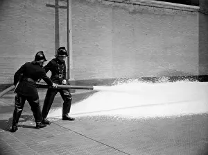 Nozzle: Firefighters training with foam extinguisher