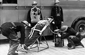 Resuscitation: Firefighters in training with resuscitation stretcher
