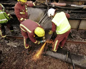 Sparks: Firefighters using cutting equipment, West London