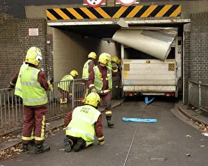 Norbury: Firefighters working to remove van trapped under bridge