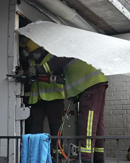 Norbury: Firefighters working to remove van trapped under bridge