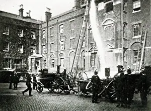 Ladders: Firemen and fire engine at work in London