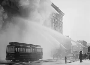 15 People: Firemen spraying three streams of high pressure