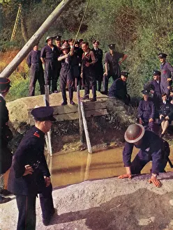 Home Front: Firemen in training at a Water Jump