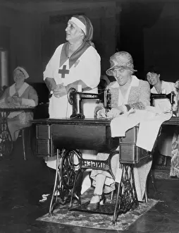 Presidents Wife: First Lady Lou Hoover uses a sewing machine at Red
