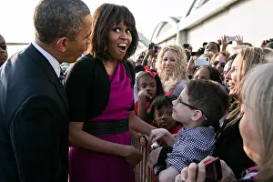 African Americans: First Lady Michelle Obama reacts while talking with