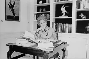 Bslo: First Lady Pat Nixon working at a small ?