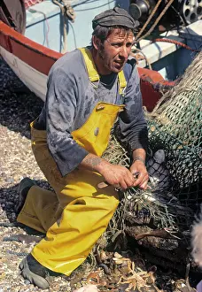 Pebble: Fisherman Opening Nets, Aldeburgh