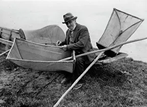 Patching: A fisherman is patching his fishing nets