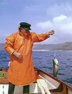 Ounce: Fisherman with pollock, Land's End, Cornwall