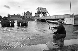 Pegasus: A fisherman sits on the towpath of the Caen Canal