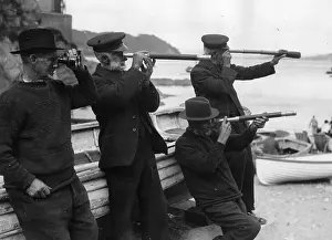 Cawsand: Fishermen follow a regatta