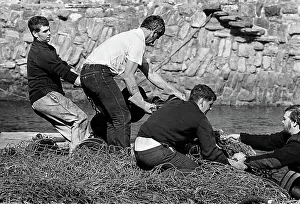 Harbourside: Fishermen with nets, St Abb's