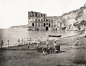 Archiecture: Fishermen pulling nets on the shore at Naples, Italy