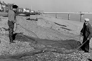Shingle: Fishermen shake their nets, Deal, Kent