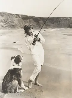 Obedient: Fishing at the beach with her dog