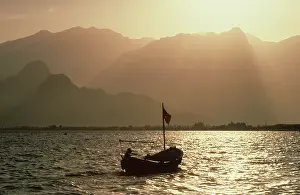 Ripples: Fishing boat with a backdrop of Taurus mountains, Antalya