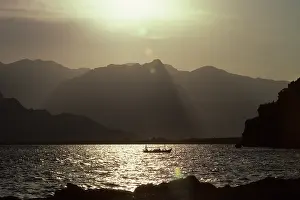 Ripples: Fishing boat with a backdrop of Taurus mountains, Antalya