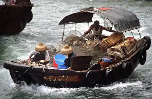 Coolie: A fishing boat returns to Aberdeen Harbour, SW Hong Kong