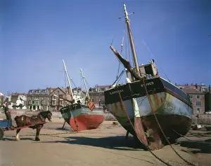 Furled: Fishing boats on St Ives beach, Cornwall