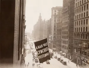 Lynched: Flag announcing another lynching. A MAN ?