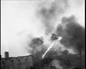 Thrower: A Flame Thrower Being Used Next to a Ruined